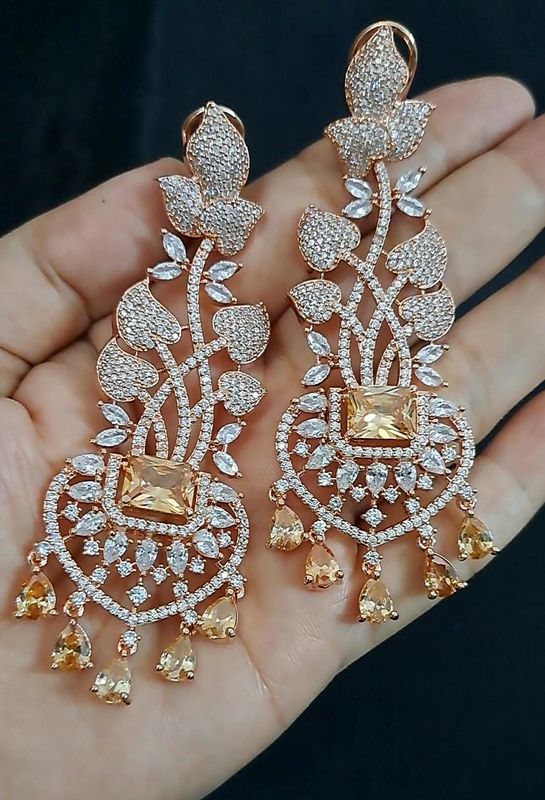 slim and long earrings gold