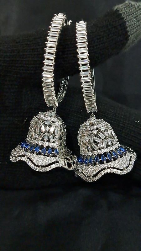 Silver blue color Jhumki earrings in AD