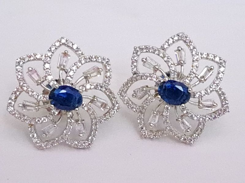 flower with center oval stone in blue silver