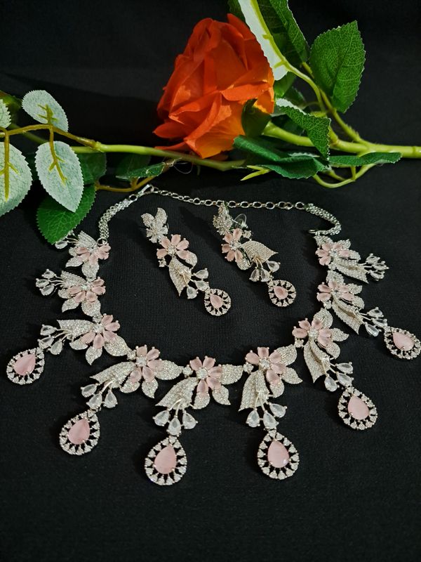 silver ad necklace in pink stones
