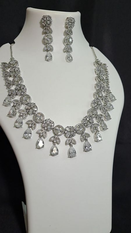 silver white necklace with drop ad stones