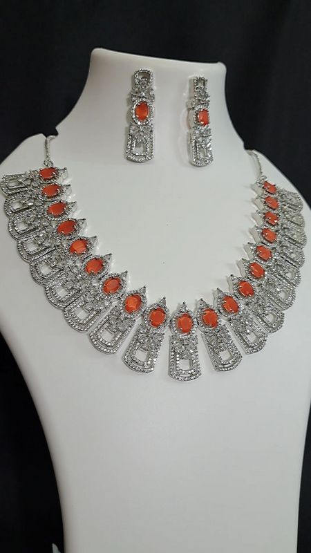orange stone ad necklace in silver