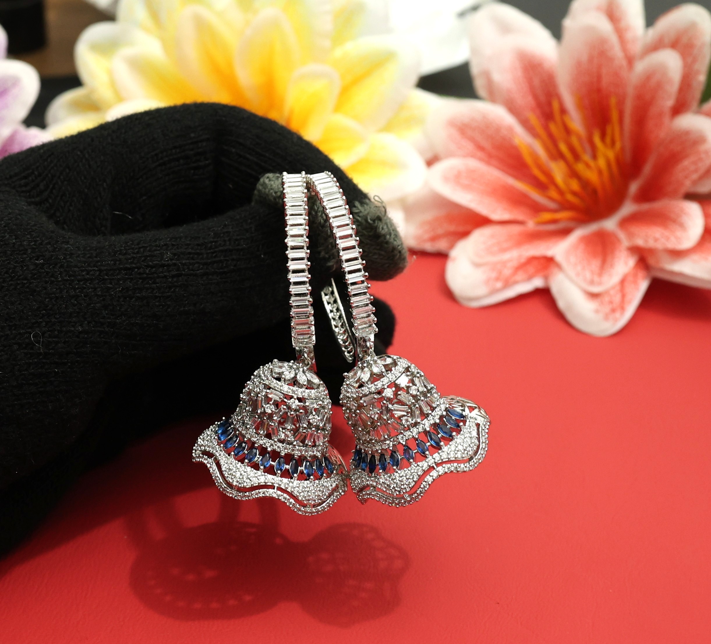 Silver blue color Jhumki earrings in AD